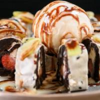 Oreo Roll · Dessert Roll. Oreo crumbled, cream cheese and strawberries. Topped with kiwi and vanilla ice...