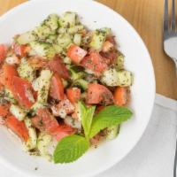 Shirazi Salad · Diced Tomatoes, Cucumbers and Onions Tossed with Olive Oil and Lemon Juice.