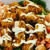 Crispy Chicken Caesar Salad · Crispy chicken, lettuce, tomatoes, Caesar dressing.