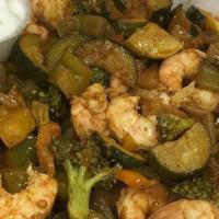 Shrimp Bowl · Fried or sautéed shrimp, rice, hummus, taxa house salad, pita bread, topped with garlic sauce.