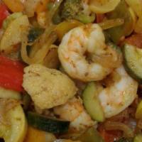 Shrimp Scampi Pasta · Sautéed shrimp, butter sautéed garlic, capers and diced tomatoes (spicy or not spicy).