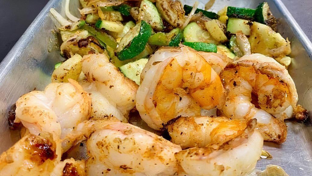 Gulf Atlantic Jumbo Shrimp · Butterflied domestic jumbo shrimp bursting with flavor cooked your way lightly floured and flash fried, garlic, butter grilled, blackened in our herbs and spices, or our popular jerk Junkanoo