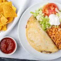 Lunch Quesadilla · Flour tortilla stuffed with cheese, beans, and choice of ground beef, chicken or mushrooms s...