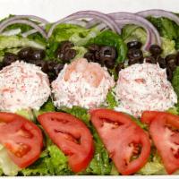 Seafood Salad · Kab and shrimp salad, mix green, tomato, chopped onions, black olives and light mayo.