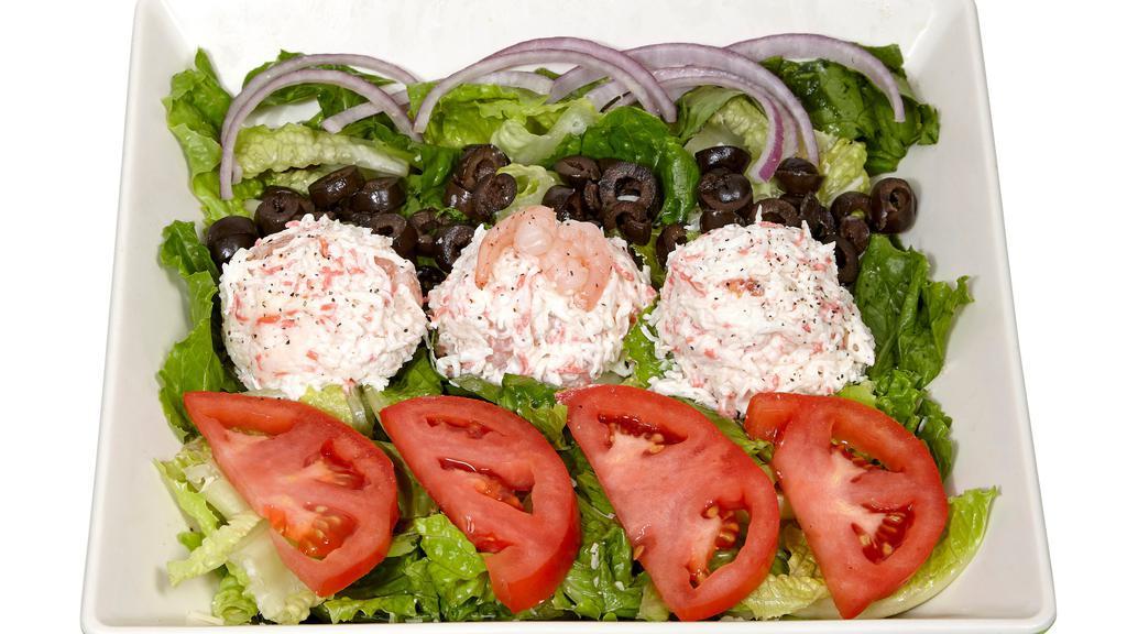 Seafood Salad · Kab and shrimp salad, mix green, tomato, chopped onions, black olives and light mayo.