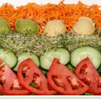Jungle Veggie Salad · With homemade avocado spread, mix green, tomato, carrot, cucumber, sprouts and homemade humm...