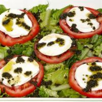Caprese Salad · Fresh mozzarella, tomato, mix greens and basil oil.