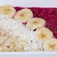 Dragon Fruit Bowl · Blended dragon fruit, topped with sliced almonds, coconut flakes, and banana.