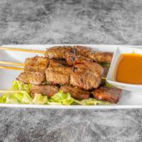 Satay Beef (4) · Marinated beef skewers, grilled & served with a home-made peanut sauce.