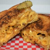 The Heart Attack Grilled Cheese · Smoked mac and cheese with bacon topped with J's green sauce.
