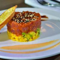 Tuna Tartare · Sushi grade yellowfin tuna / florida mango / hass avocado / sriracha aioli / sweet soy / ses...