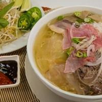 P1 - Pho Dac Biet · With various slim cuts of beef bathing in a clear mahogany beef broth, this pho bowl is pack...