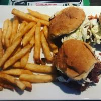 Pulled Pork Sliders · Slow roasted pork shoulder, doused with BBQ sauce topped with housemate coleslaw, serve with...