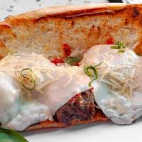 The Medford Meatball Hero · Three beef meatballs on toasted garlic bread with melted mozzarella and parmesan cheese, and...