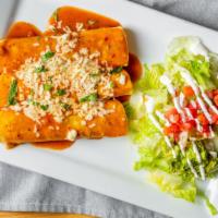 Enchiladas · Choice of seasoned ground beef, tinga chicken or cheese, topped with chili sauce and queso, ...