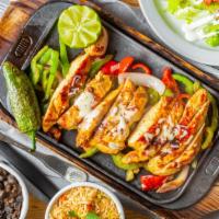 Chicken Fajitas · Chicken grilled with peppers and onions topped with shredded cheese.  Served with rice, blac...
