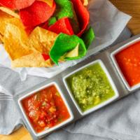 Chips & Salsa Trio · Corn tortilla chips served with our homemade salsas:  House, Tomatillo Avocado, and Roasted ...