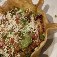 Taco Salad · Choice of seasoned ground beef, tinga chicken or grilled veggies service in a crispy flour t...