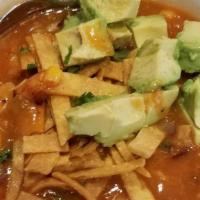 Chicken Tortilla Soup · Grilled chicken, corn, beans, onion, and peppers in a tomato broth and topped with crispy to...