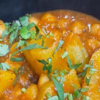 Channa Alu · Chickpeas cooked with potatoes.