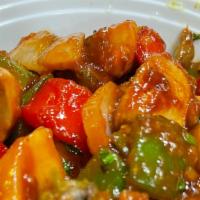 Mushroom Chilly · Mushroom cooked with green peppers, onions, soya sauce, garlic and ginger.