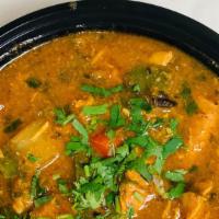 Chicken Vindaloo · Chicken cooked in tangy curry with potatoes.