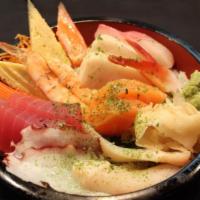 Chirashi · Assortment of sashimi and vegetables over sushi rice. Served with miso soup or house green s...