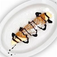 Cannoli · Crispy Pastry Shell, Ricotta Chocolate Chip Filling, Confectionary Sugar.