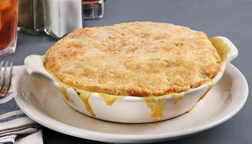 Chicken Pot Pie · Tender chicken, carrots, celery and corn
in our velvety cream sauce and topped
with our original homemade biscuit crust.