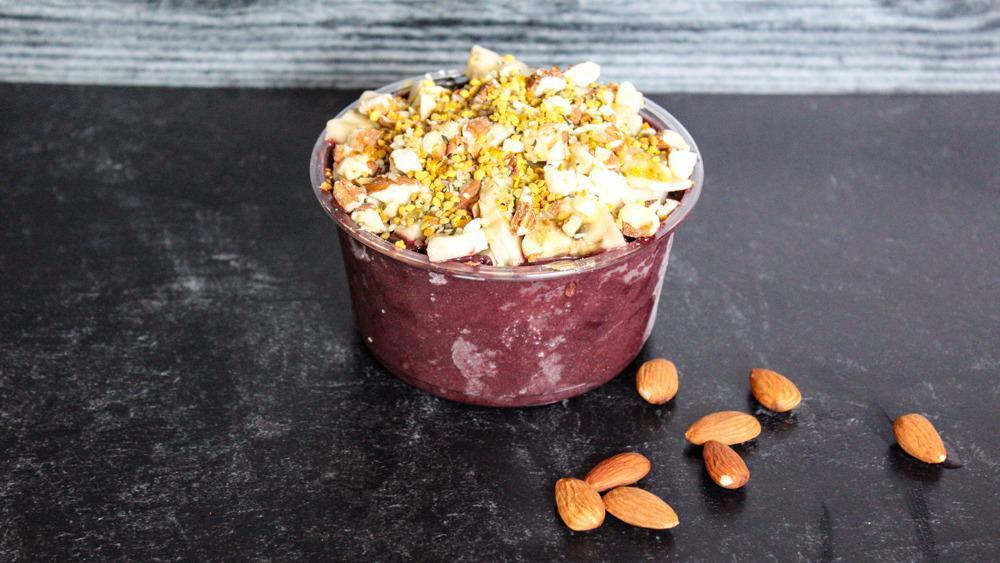 Big Island Bowl · Base: acai, peanut butter. Toppings: granola, banana, almonds, hemp seeds, bee pollen, local honey. Recommended add-on: cacao nibs.