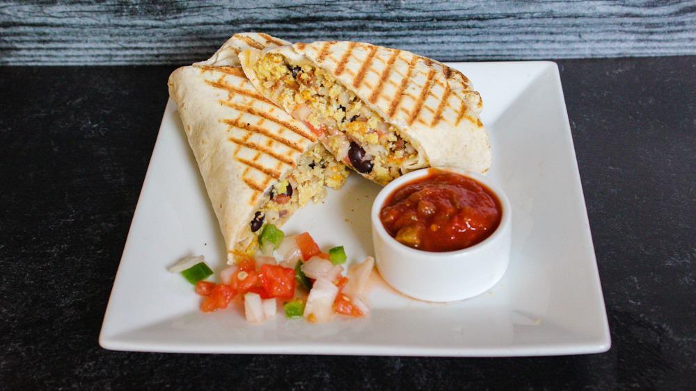 Grilled Breakfast Burrito · Hearty burrito with spicy chorizo, eggs, black beans, hash browns, house-made salsa, grilled and served with sour cream or salsa. Suggested add on is avocado.

***This item cannot be modified***
