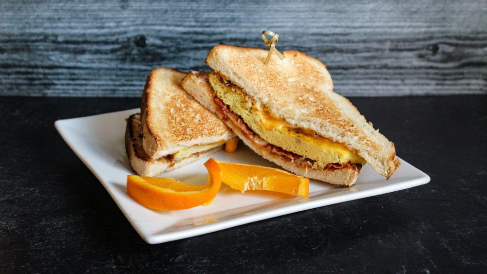 Breakfast Sandwich · Hickory smoked bacon, eggs, sharp cheddar cheese, and mayo on toasted oatmeal bread.