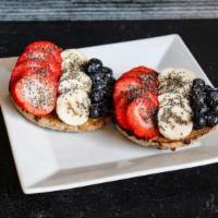 Daybreak Bagel (V) · Open-faced blueberry bagel from Canadian Bakin' topped with almond butter, bananas, strawber...