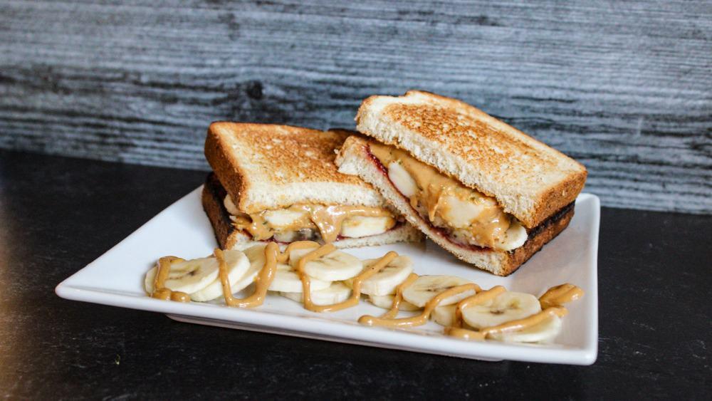 The King · Peanut Butter, Banana, Scout Raspberry Tart Preserves, and Hemp Seeds on Toasted Oatmeal Bread.