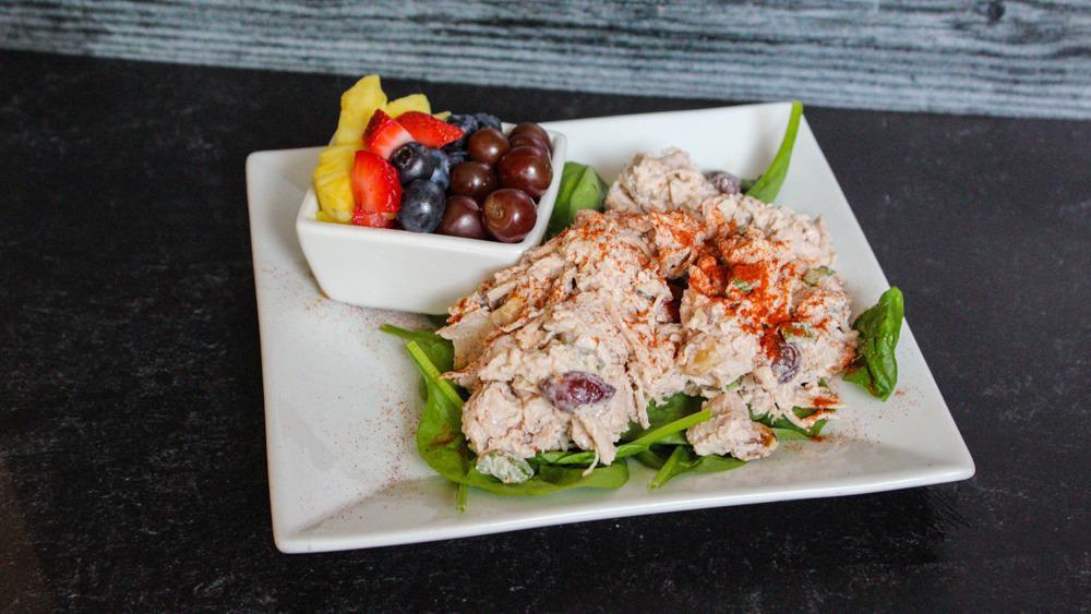 Chicken Salad · All-white meat chicken, walnuts, grapes, and celery served on a croissant or bed of spinach With a side of chips or fruit.