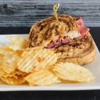 Classic Reuben · Steamed roast beef, sauerkraut, provolone cheese, 1000 island dressing on marble rye. With a...