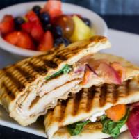 Turkey & Goat Cheese Panini · Turkey, Goat Cheese, Tomato, Spinach, Carmelized Red Onion, and a Balsamic Reduction pressed...