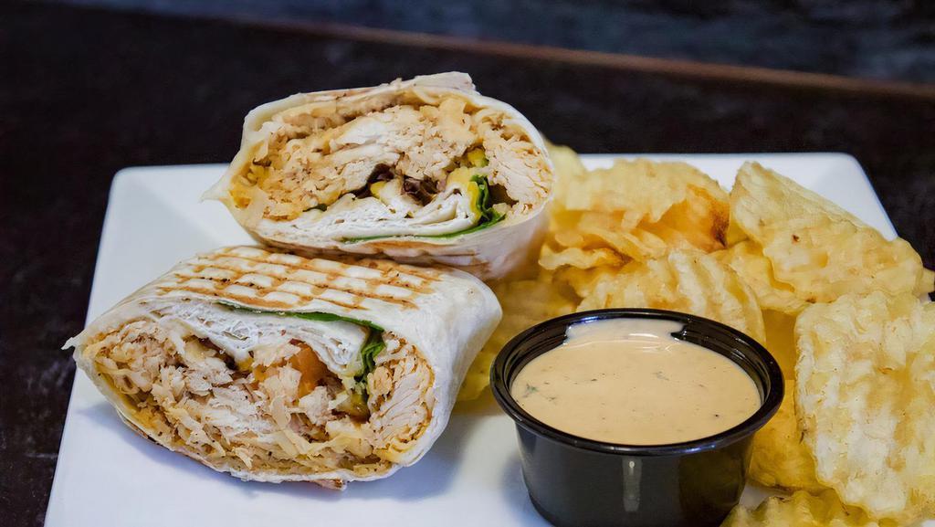 Southwest Chicken Wrap · All white meat chicken, shredded cheddar-jack cheese blend, spring mix, and tomatoes grilled and served with a side of chipotle ranch.