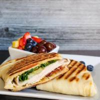 Leslie'S Turkey Club Panini · Turkey, bacon, spinach, pickles, and spicy brown mustard with melted havarti cheese pressed ...