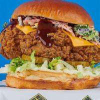 Bbq Beast Chicken Sandwich · Feed the beast with cheese, mayo, lettuce, pickles and slaw, smothered in BBQ sauce.