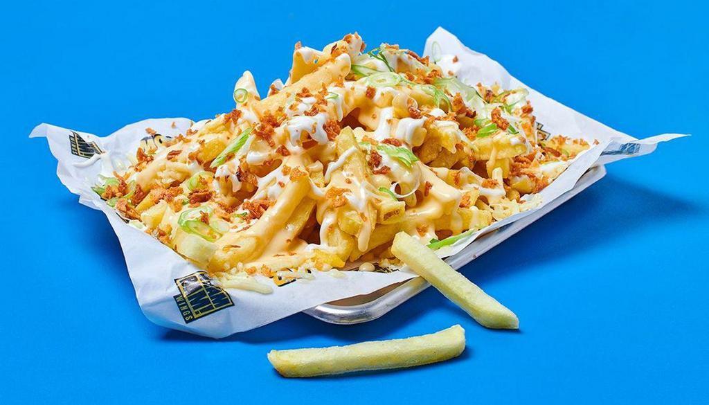 Garlic Mayo Loaded Fries  · Golden fries covered in cheese sauce, loaded up with spring onion, crispy onion, and garlic mayo.