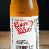 Country Club · Refresco dominicano. Merengue, rojo. / Dominican soda. Meringue, red.