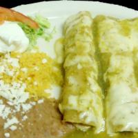 Enchiladas Mexicanas · Made with chicken or meat flour tortillas with a special sauce on top of cheese and cream ri...