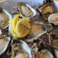 1/2 Dozen Fresh Raw Oysters · 1/2 dozen of the finest freshly shucked! freshly shucked and served with ice and lemons, coc...
