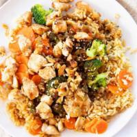 Sweet Teriyaki Chicken Rice Bowl · Grilled marinated teriyaki chicken with diced onions and peppers over steamed broccoli and c...