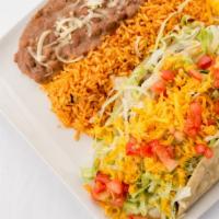 Taco Tradicional Dn · Crispy tacos with seared ground sirloin, lettuce, cheddar cheese and tomato