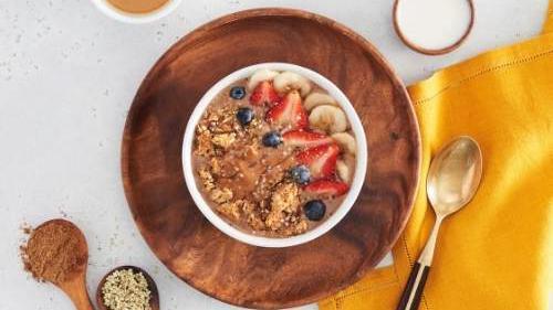 Cappuccino Bowl · Calling all coffee and cappuccino lovers! Your morning pick me up has almond milk, cognitive coffee powder, almond butter, hemp seeds, banana, and a pinch of pink sea salt. Topped with granola, almond butter, strawberries, blueberries, bananas, hemp seeds, and local honey.