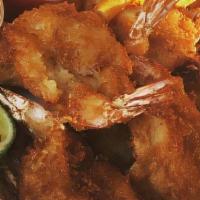 Fried Shrimp · Eight jumbo shrimp battered and deep fried golden served on a bed of lettuce with cocktail s...