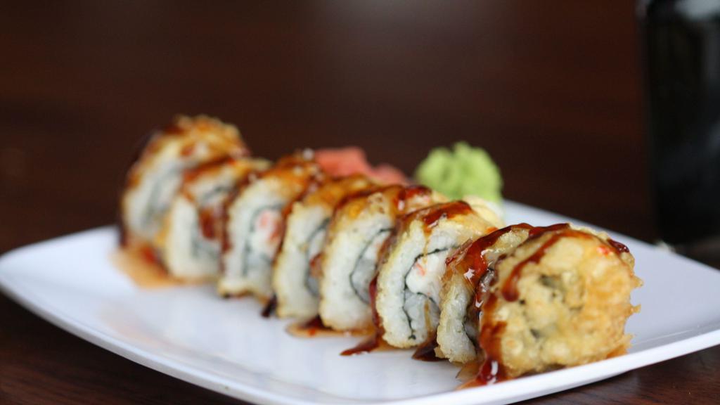 Spicy Crab Meat Tempura Roll · Crab meat  with  spicy mayo  and crunch , creamy cheese, lightly  fried  topped with  eel sauce and yum yum sauce.
