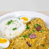Aji De Gallina · Chicken breast shredded with yellow pepper and Parmesan sauce served with potato and white r...